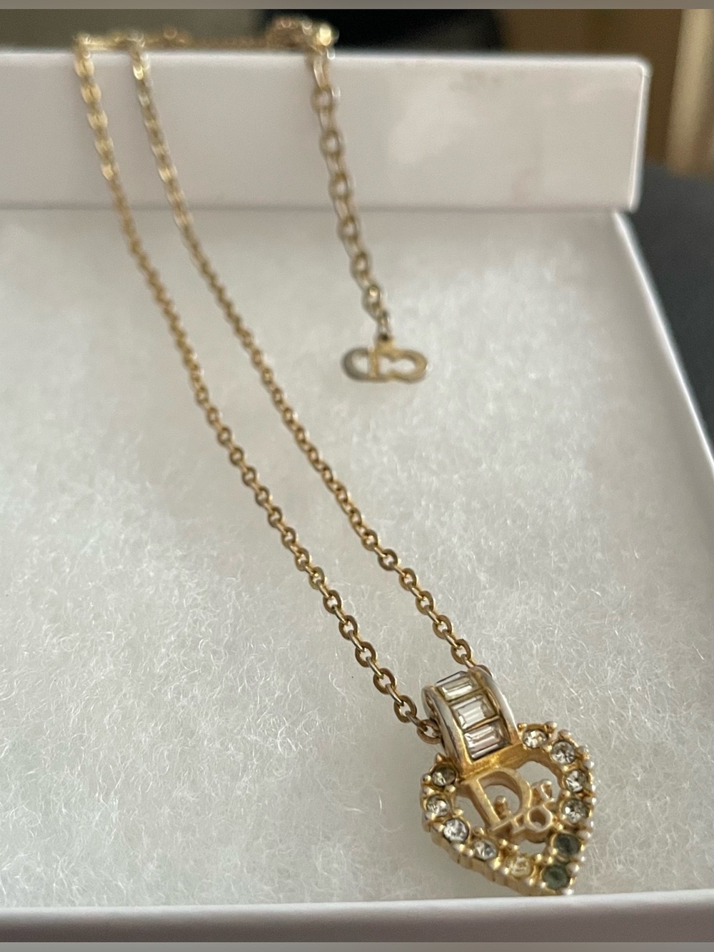 Christian Dior Gold Heart Pendant Necklace with 'D' Initial Accent..